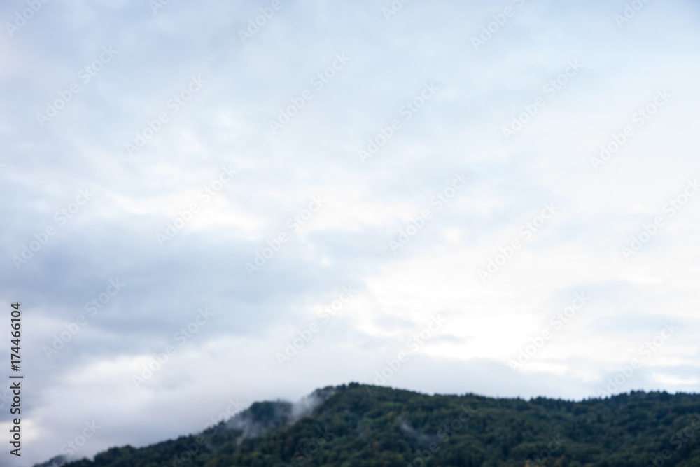 mountain with forrest and cloudy stormy sky clouds storm nature red blue sky