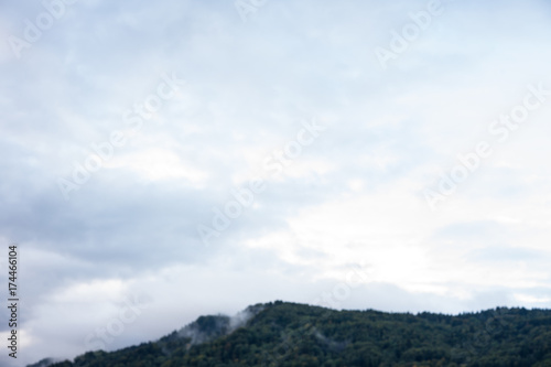 mountain with forrest and cloudy stormy sky clouds storm nature red blue sky