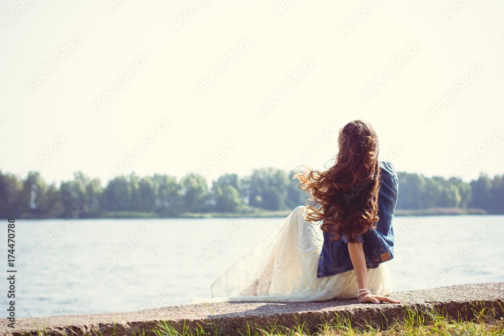 Middle aged stylish woman walk in nature city park at good sunny day Middle aged stylish woman walk in nature city park at good sunny day