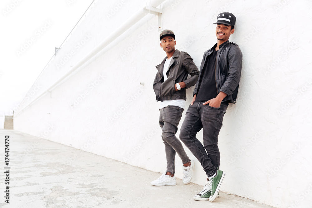 Two young african men friends standing outdoors Two young african men friends standing outdoors