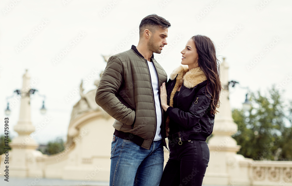 Beautiful couple wear jacket and hugging at each other