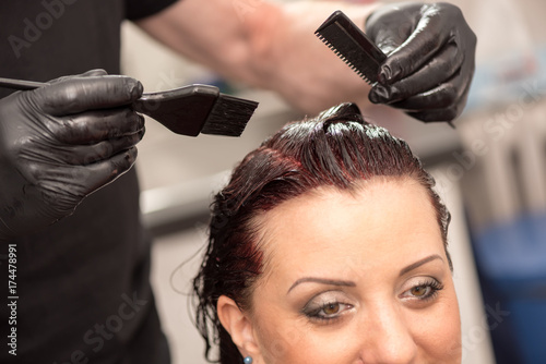 Hairdresser coloring hair