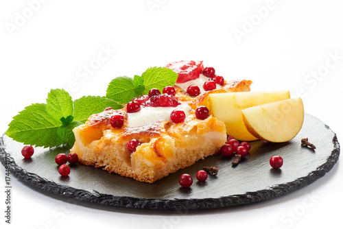 Apple cake with cream, jam and forest berries