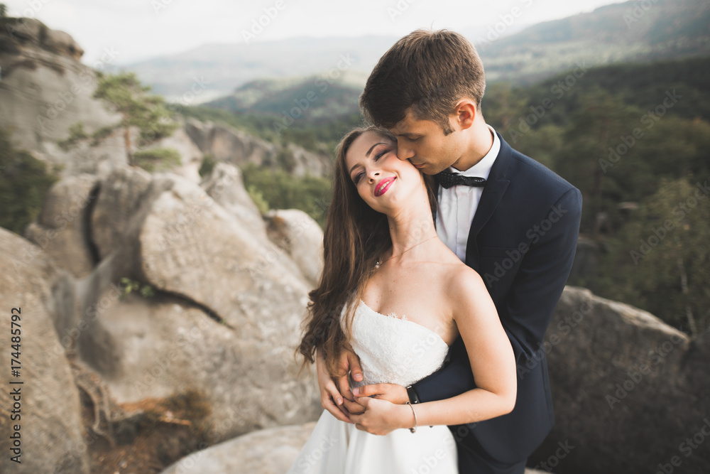 Sensual portrait of a young wedding couple. Outdoor