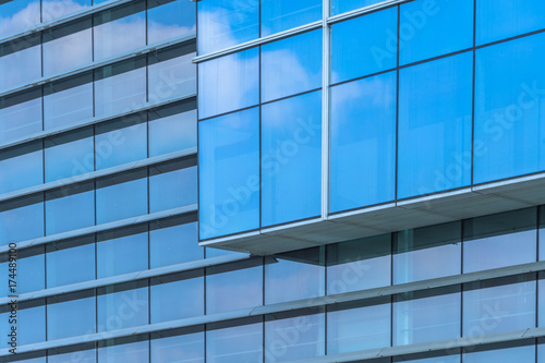 Clouds Reflected in Windows of Modern Office Building..