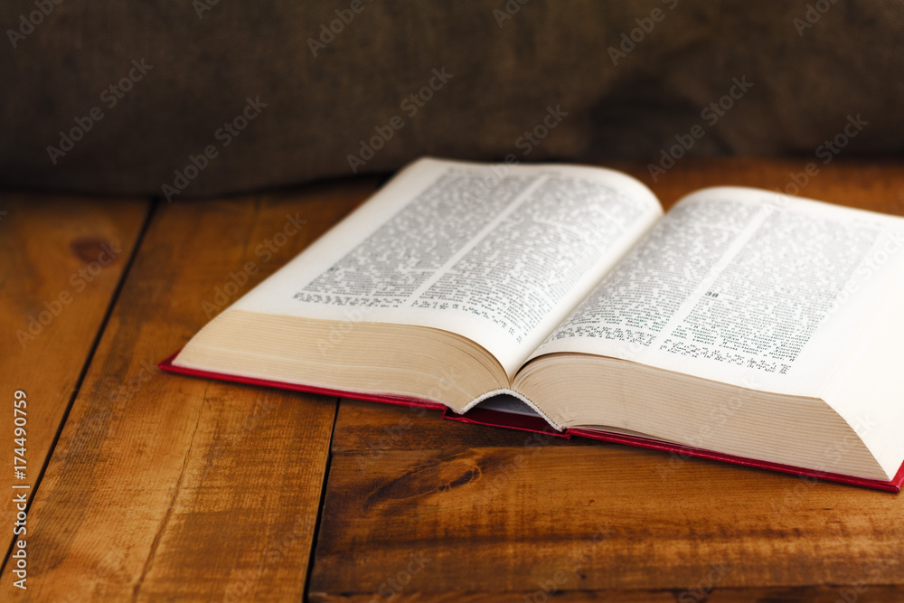 Obraz premium book open old, wisdom desk read religion parchment literature table fiction dictionary history used historic wooden school concept