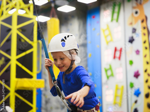 little boy learn sport climbing