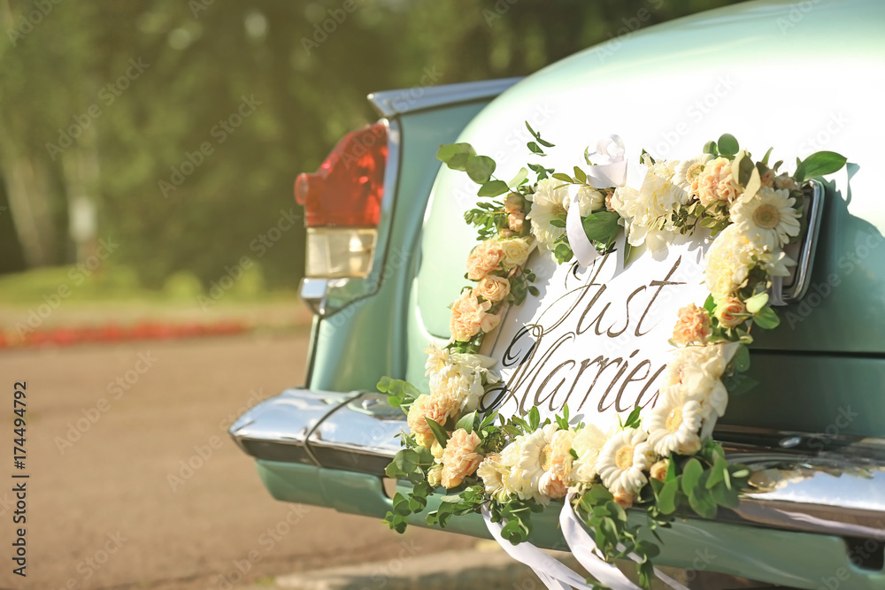 Beautiful wedding car with plate JUST MARRIED outdoors Stock Photo