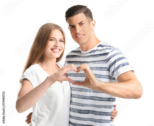 Young couple holding hands ...