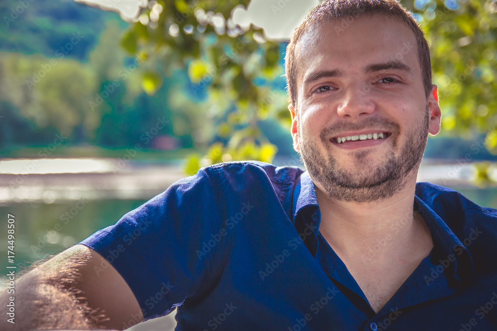 Portrait of a handsome young man with beard smiling Portrait of a handsome young man with beard smiling