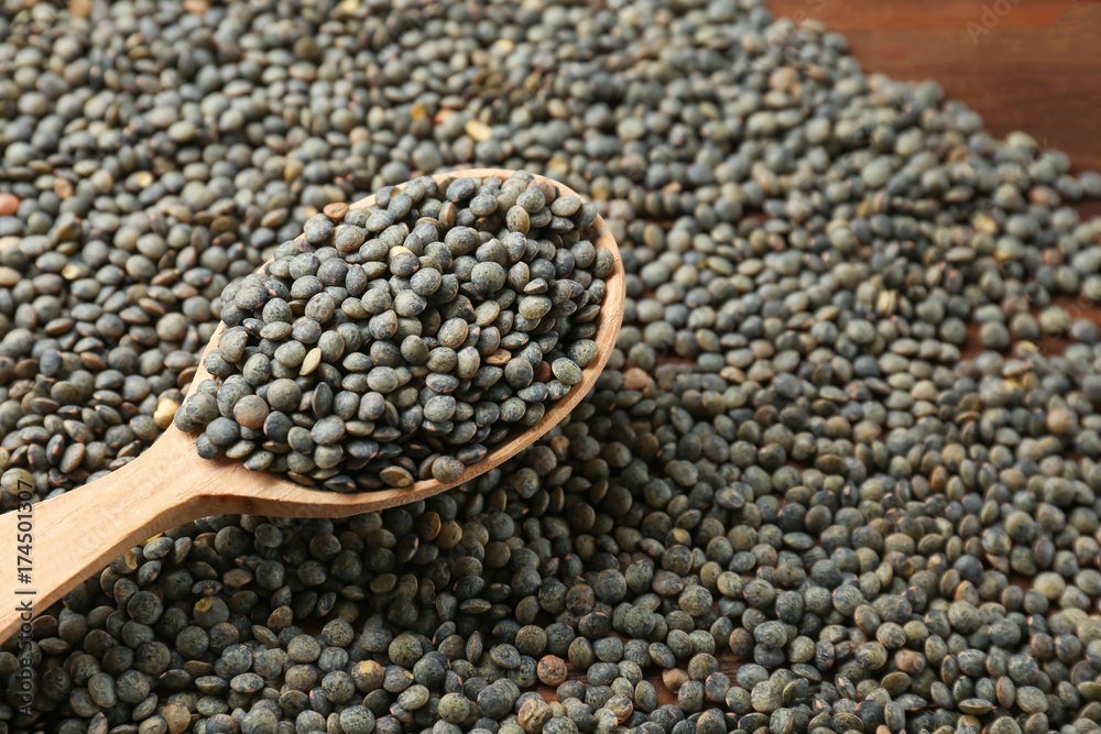 Spoon with healthy lentils, closeup Spoon with healthy lentils, closeup