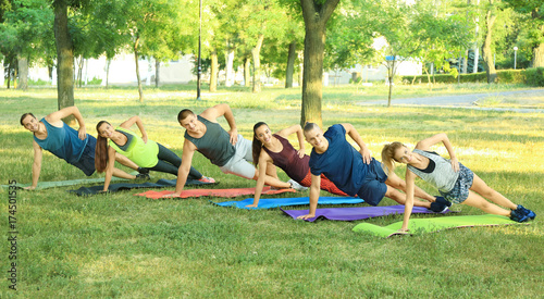 Young sporty people doing e...