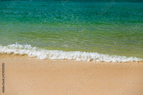 Beautiful gentle wave and sandy at the shallow beach