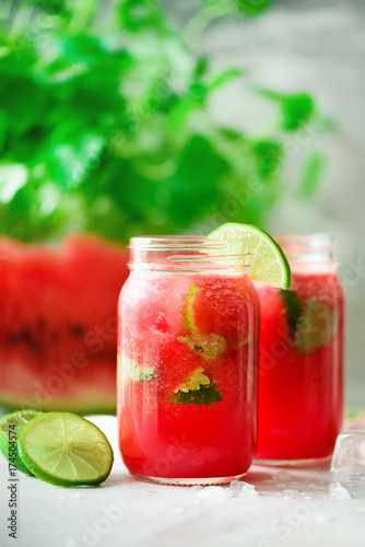Wallpaper Mural Fresh red watermelon smoothie in glass jar with straw, ice, mint and lime on light background, copy space Torontodigital.ca