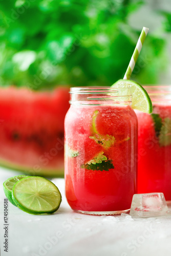 Wallpaper Mural Fresh red watermelon smoothie in glass jar with straw, ice, mint and lime on light background, copy space Torontodigital.ca