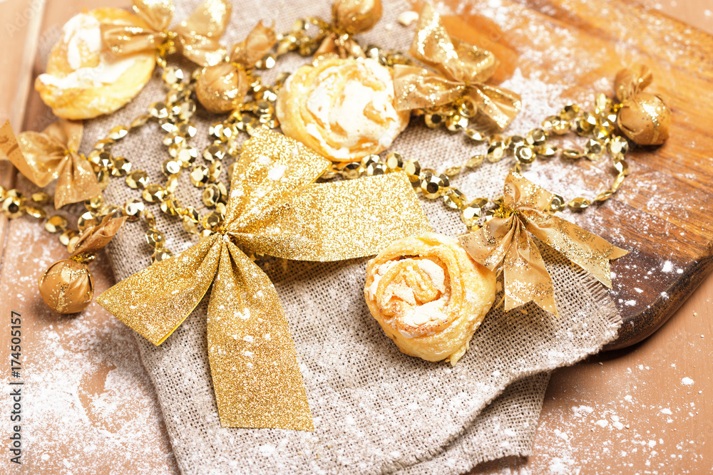 Fototapeta premium Gingerbread cookies hanging over wooden background. christmas cookies