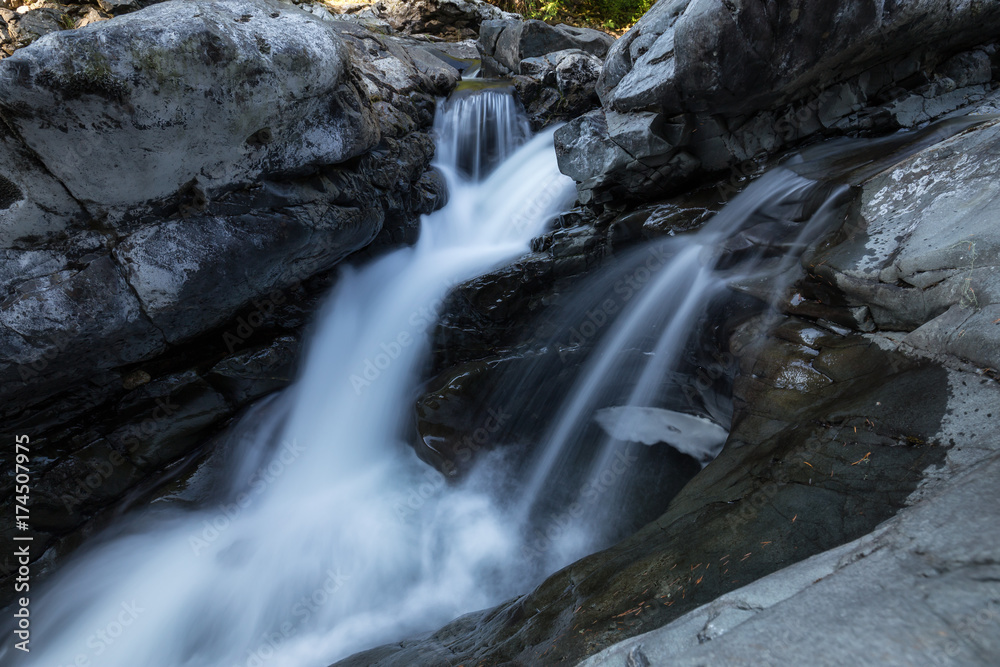 Water spring running down the smooth rocks in a beautiful canyon. Taken in Sooke Potholes Provincial Park near Victoria, Vancouver Island, BC, Canada.
Water spring running down the smooth rocks in a beautiful canyon. Taken in Sooke Potholes Provincial Park near Victoria, Vancouver Island, BC, Canada.