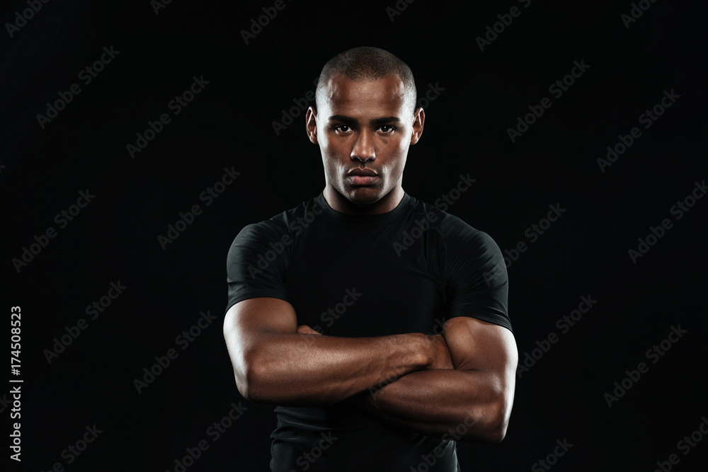 Serious afro american sports man looking at camera