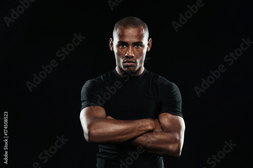 Serious afro american sports man looking at camera