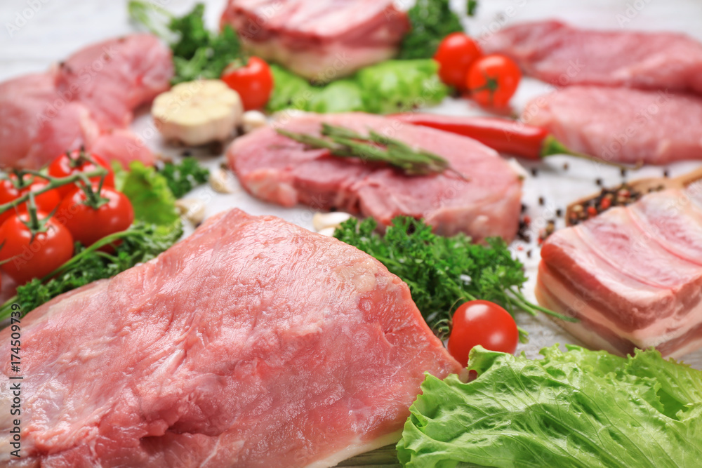 Different types of meat on wooden table