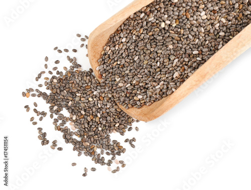 Wooden scoop with chia seeds on white background