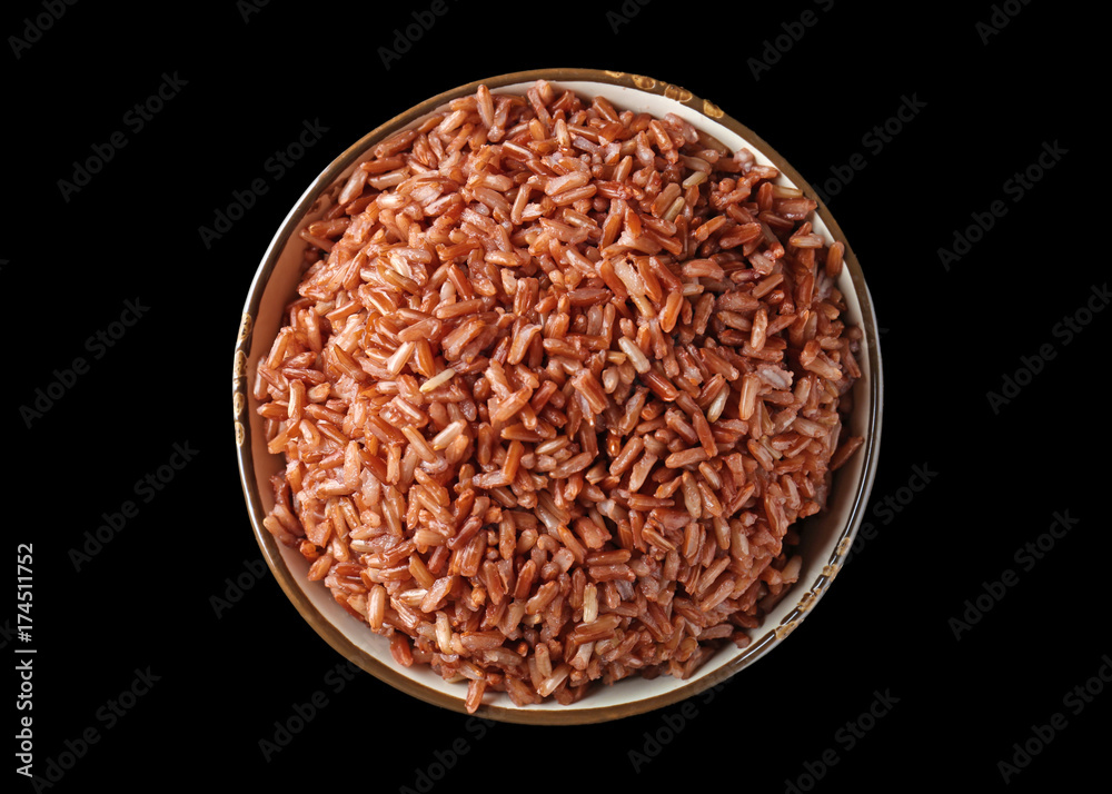 Bowl with brown rice on black background Bowl with brown rice on black background