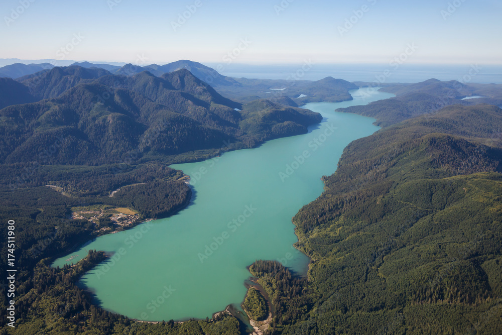 Aerial view of Nitinat Lake during a vibrant summer day. Located in Vancouver Island, British Columbia, Canada.