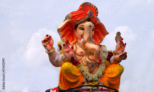 Closeup of Hindu God Ganesha idol being taken on a vehicle for immersion in water body after prayers during ganesh chathurthi festival