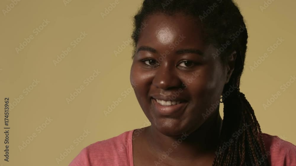 Happy black woman looking at camera Happy black woman looking at camera