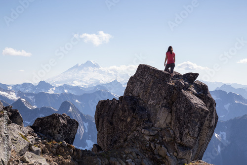 Woman enjoying the beautiful Canadian Mountain Landscape view on top of the peak. Taken on top of MacDonald Peak near Chilliwack  East of Vancouver  BC  Canada.