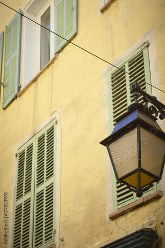 Yellow facade in a Street of Hy  res - Provence