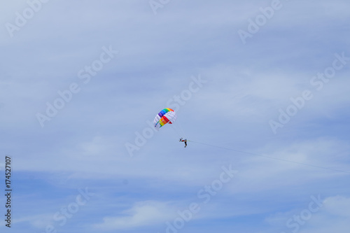 The sky parachute has a blue backdrop background.