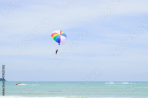 The sky parachute has a blue backdrop background.