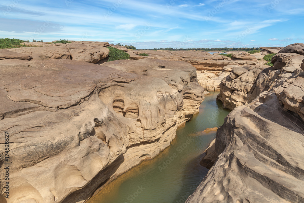 Fototapeta premium view of Canyon at Hat chom dao in Ubon Ratchathani Thailand with blue sky background