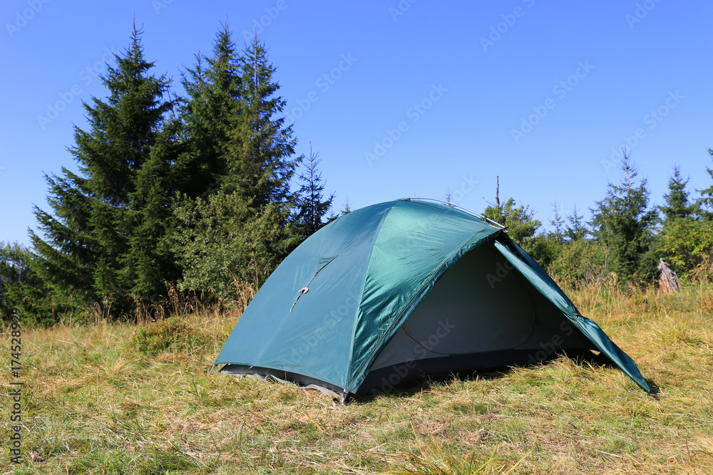 tourist tent on meadow