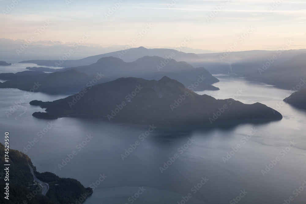 Aerial view of Howe Sound during a vibrant summer sunset. Taken North of Vancouver, British Columbia, Canada.
