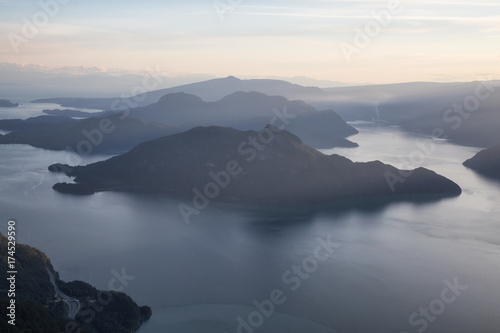 Aerial view of Howe Sound during a vibrant summer sunset. Taken North of Vancouver, British Columbia, Canada. 