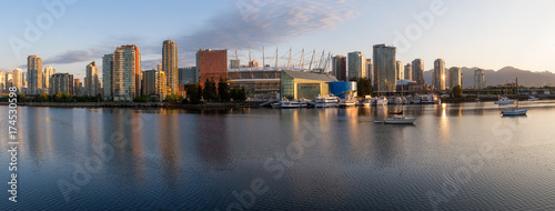 Panoramic view of Vancouver Downtown City Skyline in False Creek, British Columbia, Canada. Taken during a bright summer sunrise.