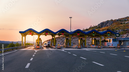 Cars passing through the toll gate on the motorway, vivid trabel photo