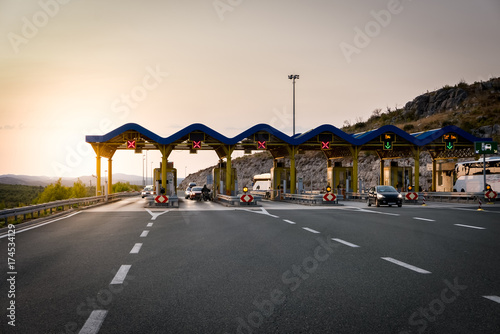 Cars passing through the toll gate on the motorway photo