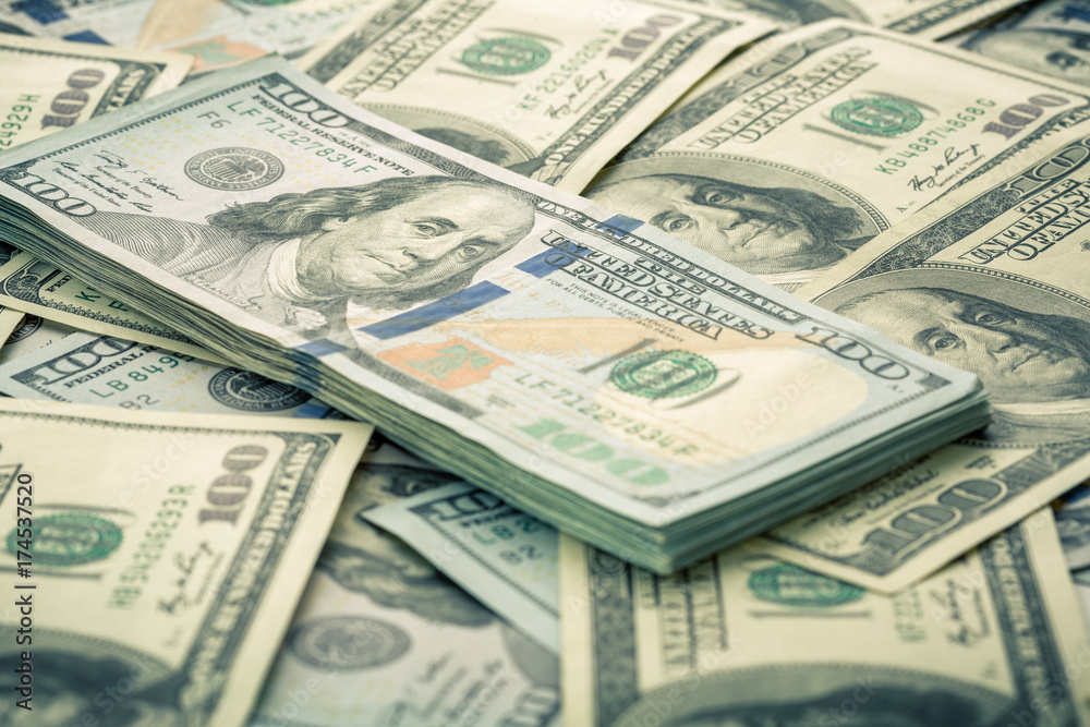 Lot of one hundred dollar bills close-up background Lot of one hundred dollar bills close-up background