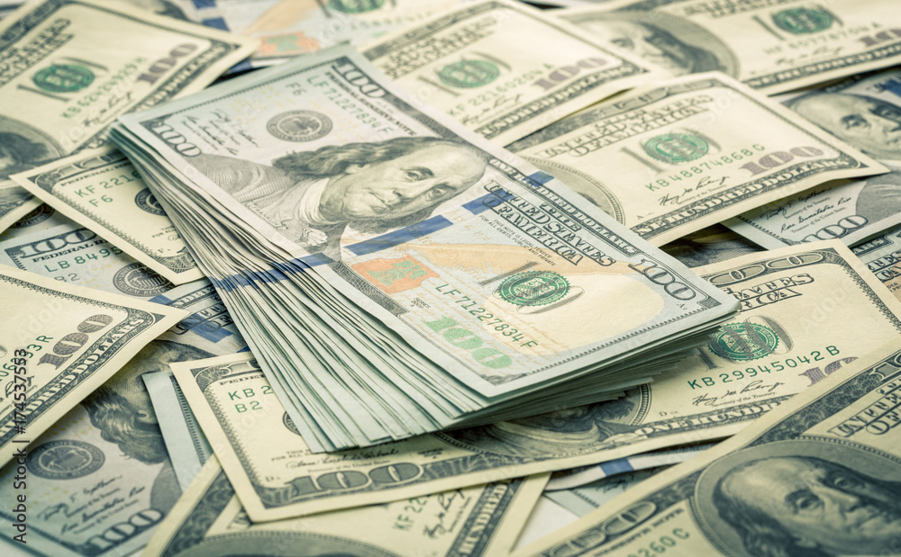 Lot of one hundred dollar bills close-up background Lot of one hundred dollar bills close-up background
