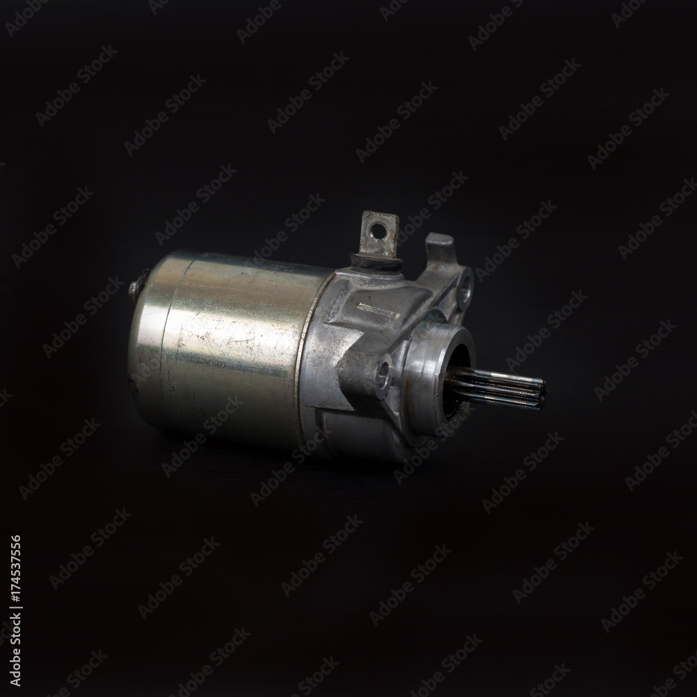 Broken Starter Motor for motorcycle on background Broken Starter Motor for motorcycle on background