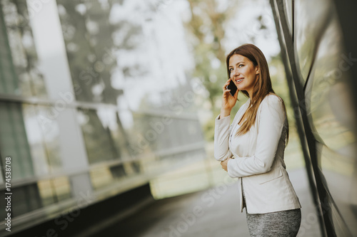 Businesswoman using mobile ...