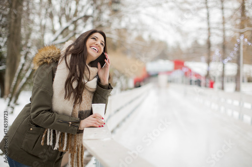 Young woman using phone in ...