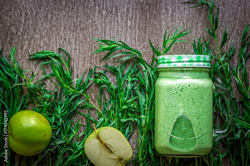 Green smoothie with spinach and apples in glass photo