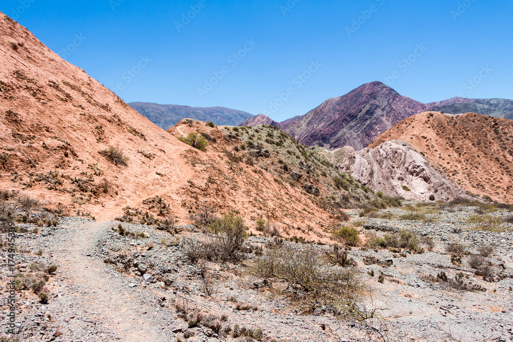 Purmamarca, hills of several colors among which predominates red, violet, purple, pink, orange, brown