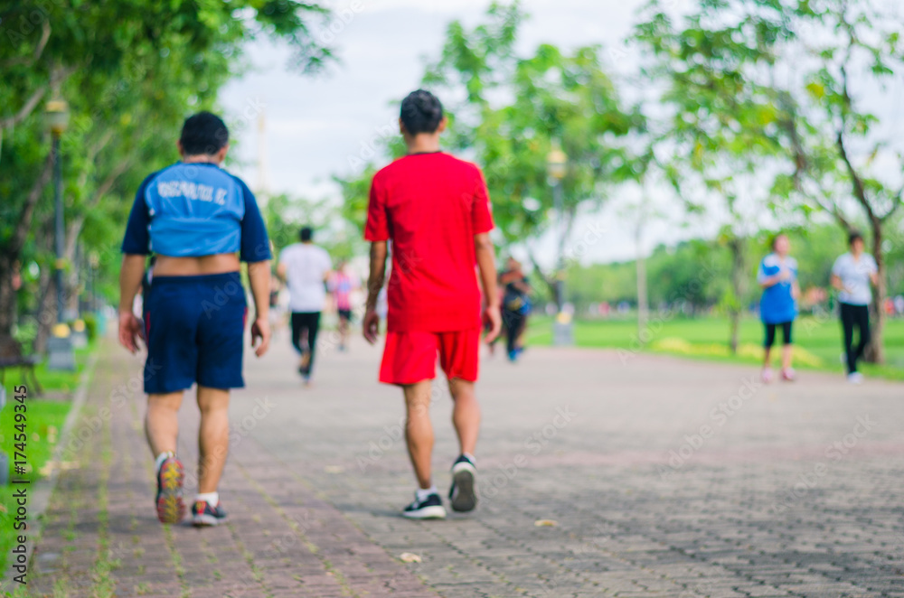 people exercise with running or jogging with motion blur on the morning in the park for healthy.