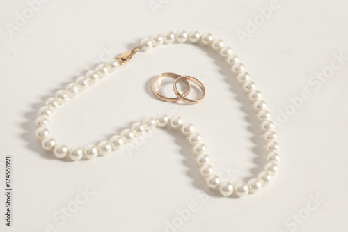 Pearl necklace in heart shape end wedding rings