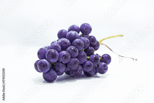 Raw dark grapes isolated on white background.